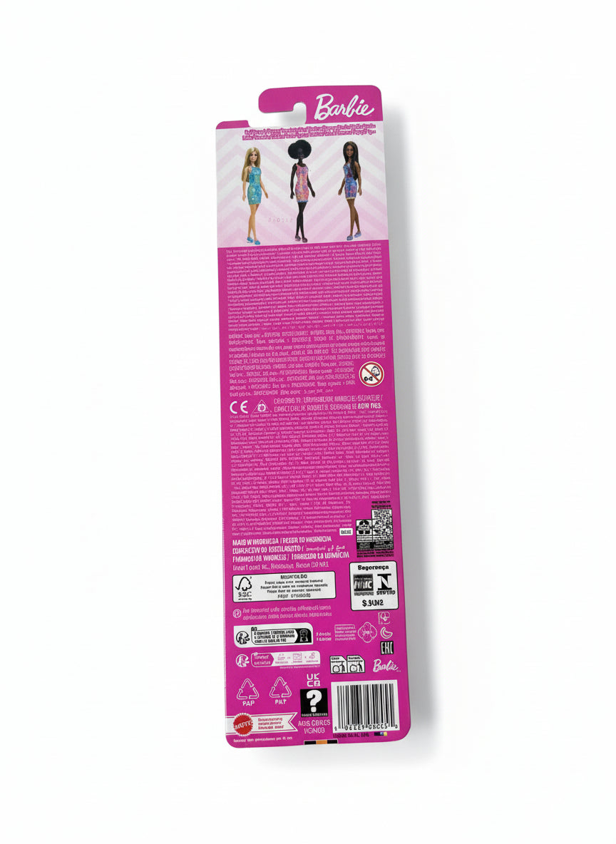 Barbie doll packaging with a pink label on a white surface