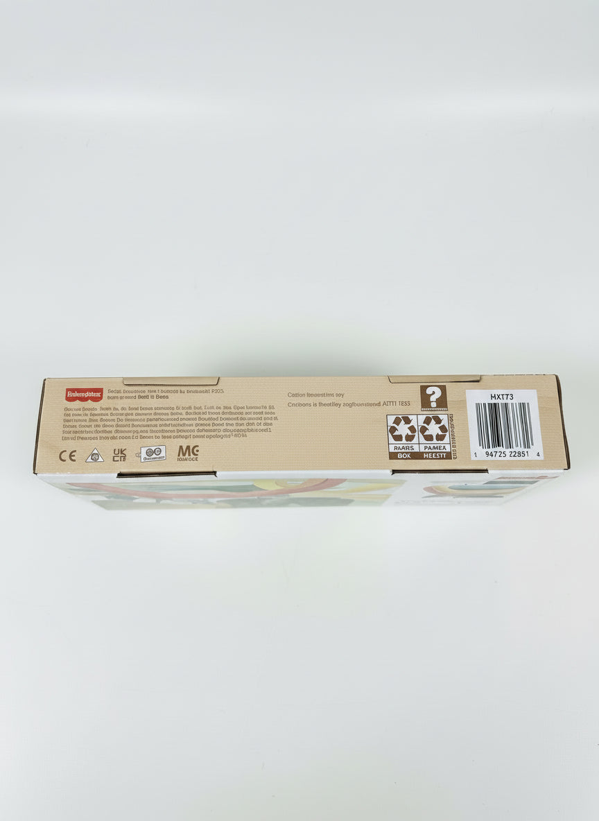Rectangular box with text and barcodes on a light gray surface