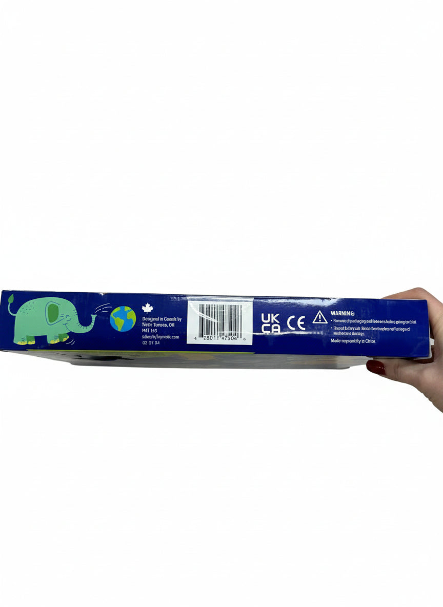 Hand holding a blue box with an elephant design on a wooden floor