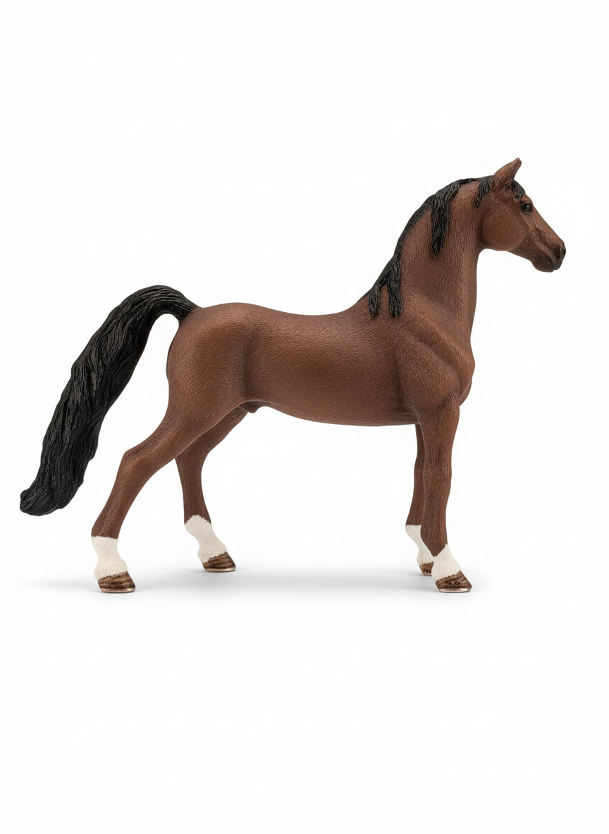 Brown horse toy with a visible age recommendation tag on a light wooden floor.
