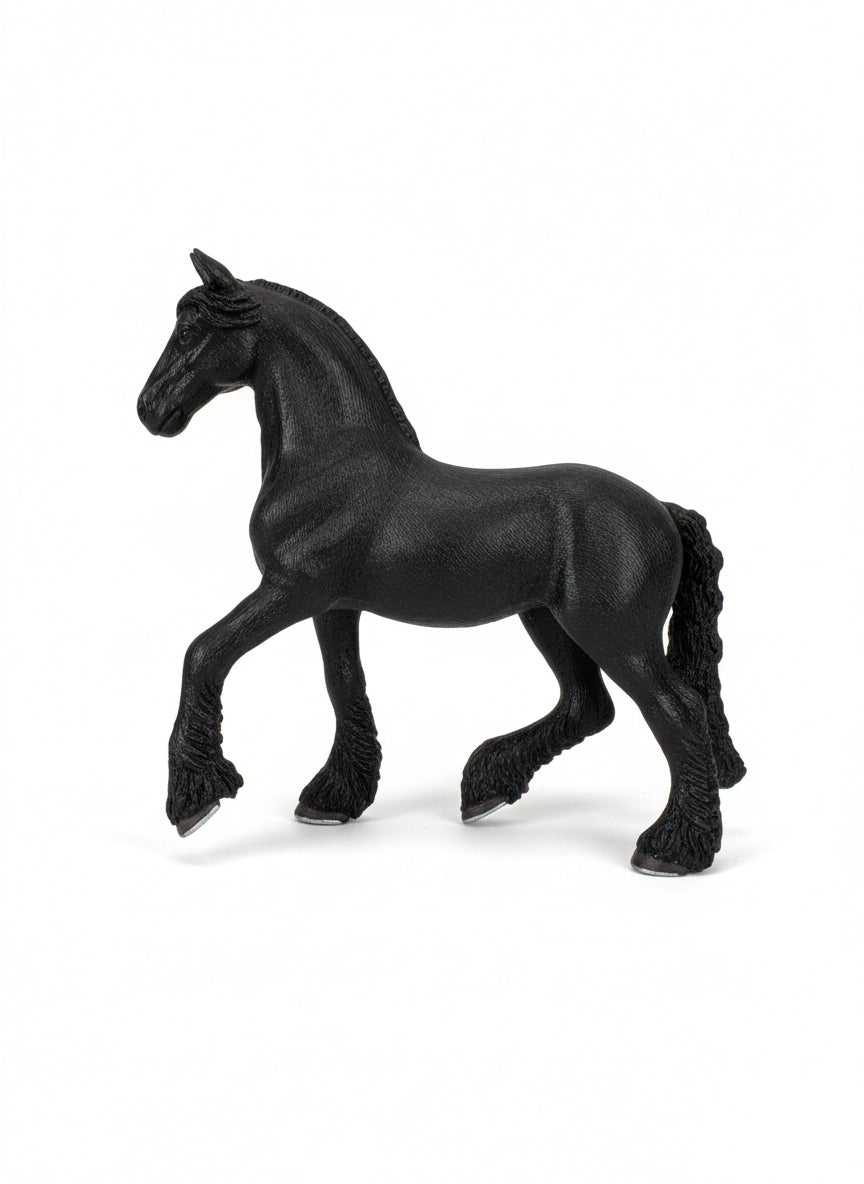 Black horse figurine with a price tag on a light wooden surface
