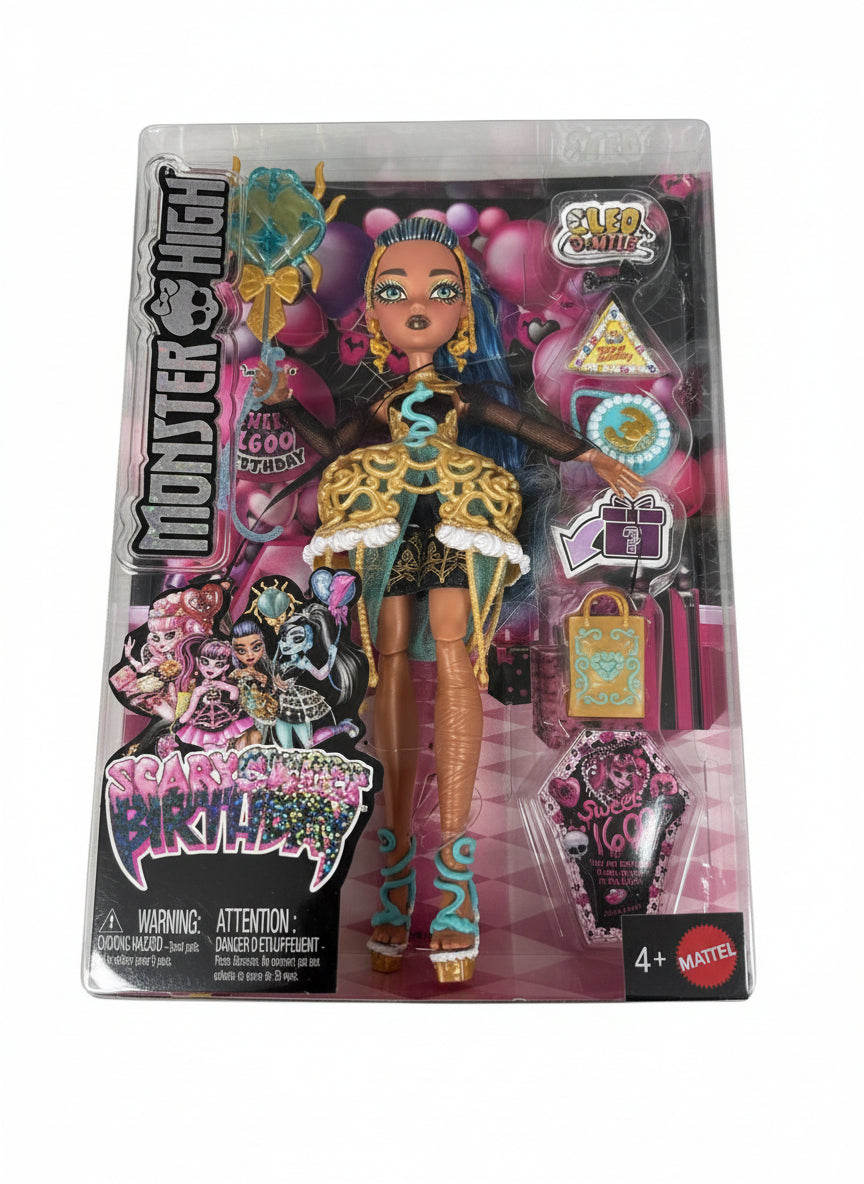 Monster High doll in packaging on a wooden surface