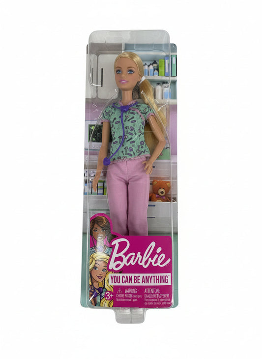 Barbie doll packaging on a wooden surface