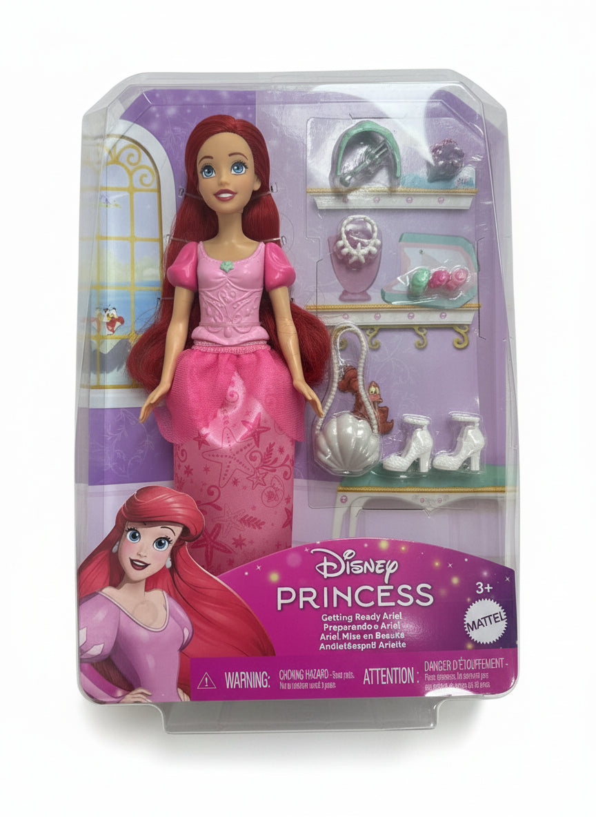 Disney Princess Ariel doll packaging on a wooden surface