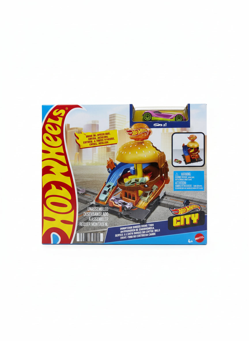 Hot Wheels toy packaging on a wooden floor