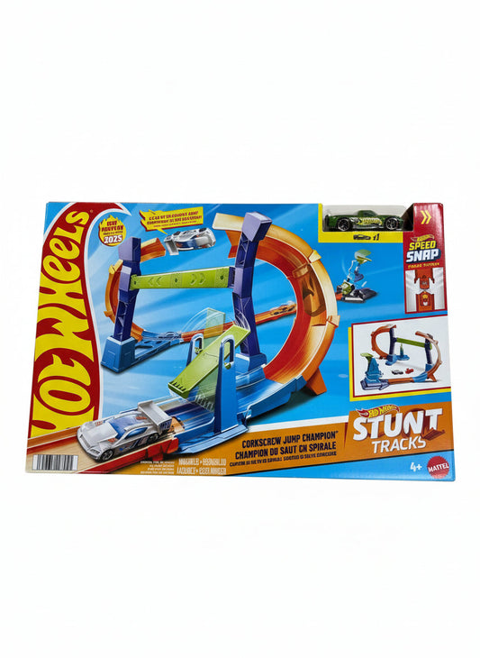 Hot Wheels Stunt Tracks toy set packaging on a wooden floor