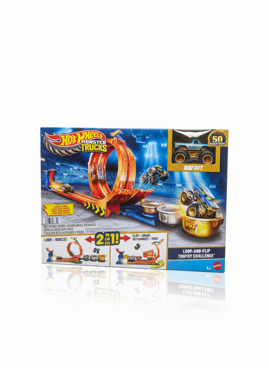 Hot Wheels Monster Trucks toy set packaging on a wooden surface