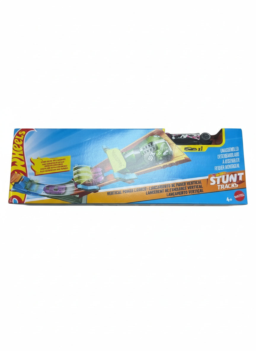 Hot Wheels stunt tracks packaging on a wooden floor