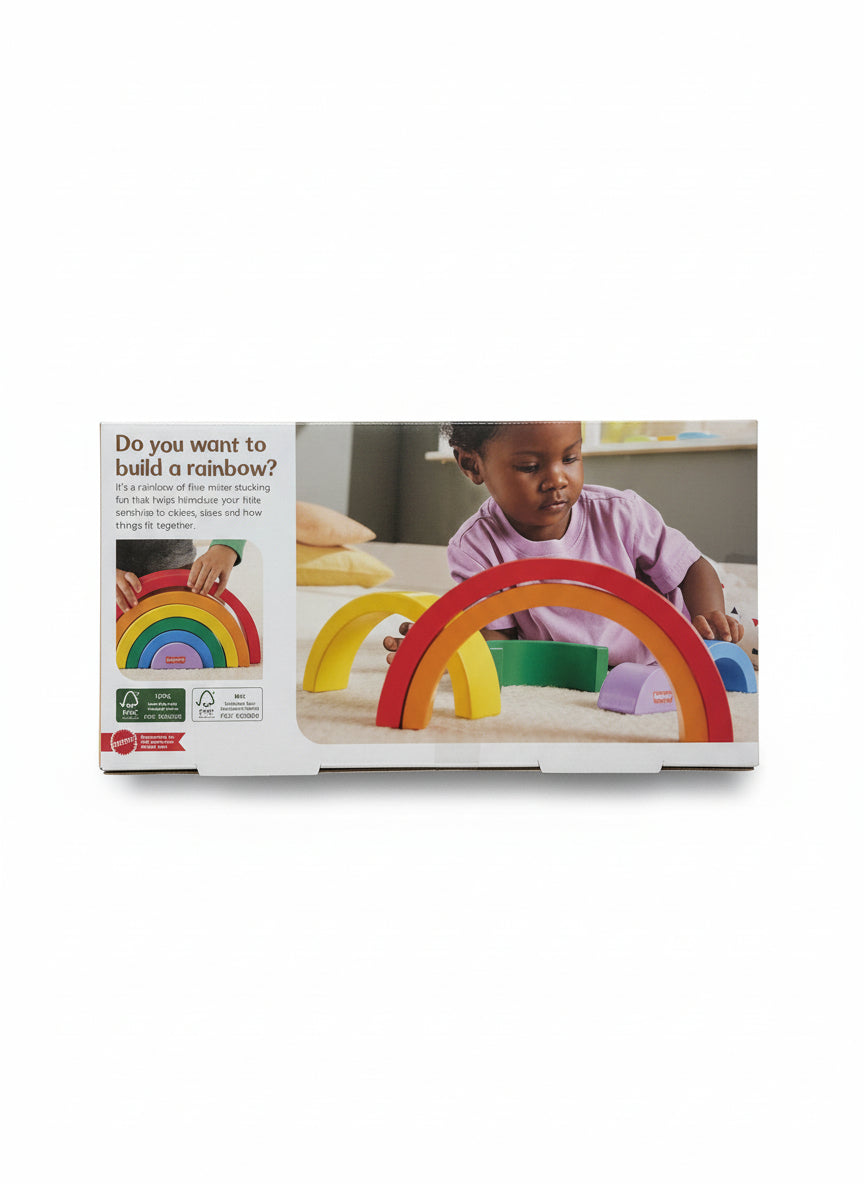 Product packaging with colorful wooden rainbow toys and a child playing with them on a gray surface.