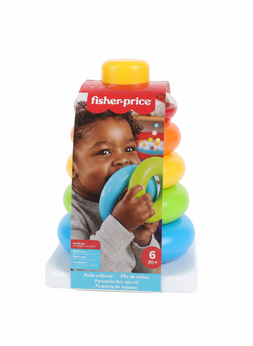 Fisher-Price toy packaging with colorful balls on a gray surface