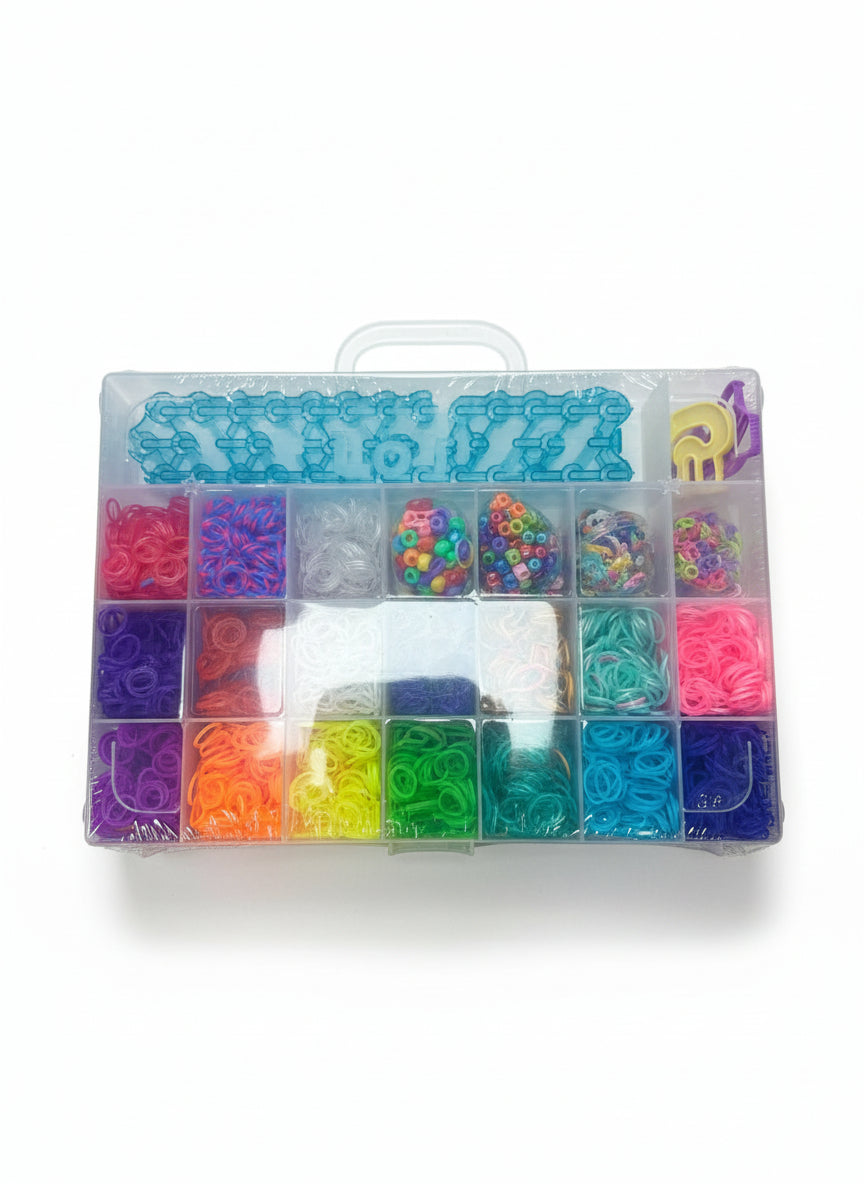 Colorful rubber band kit in a clear plastic case on a wooden surface
