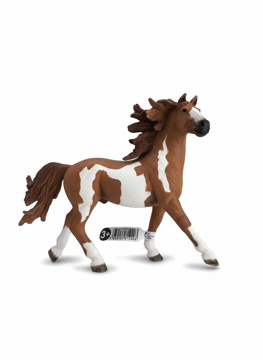 Plush horse toy on a light wooden floor
