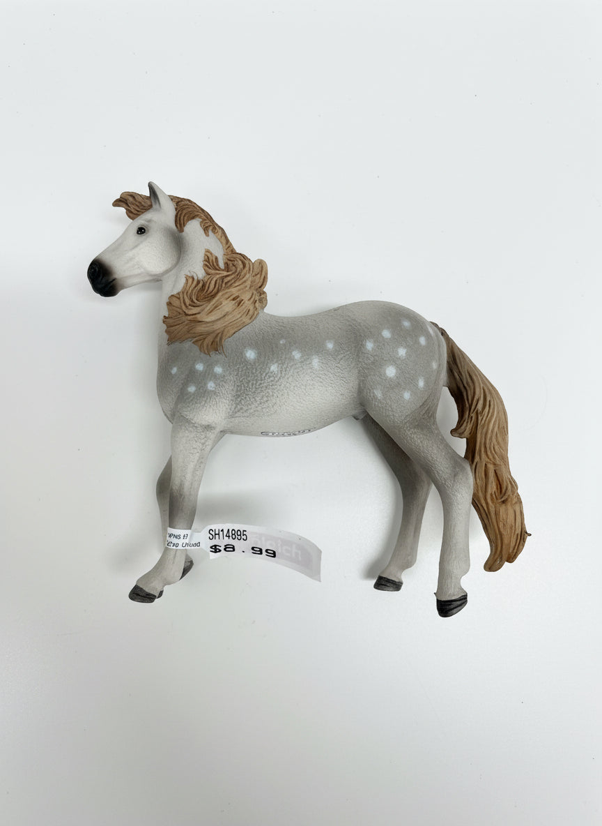 Gray toy horse with a brown mane on a light wooden floor