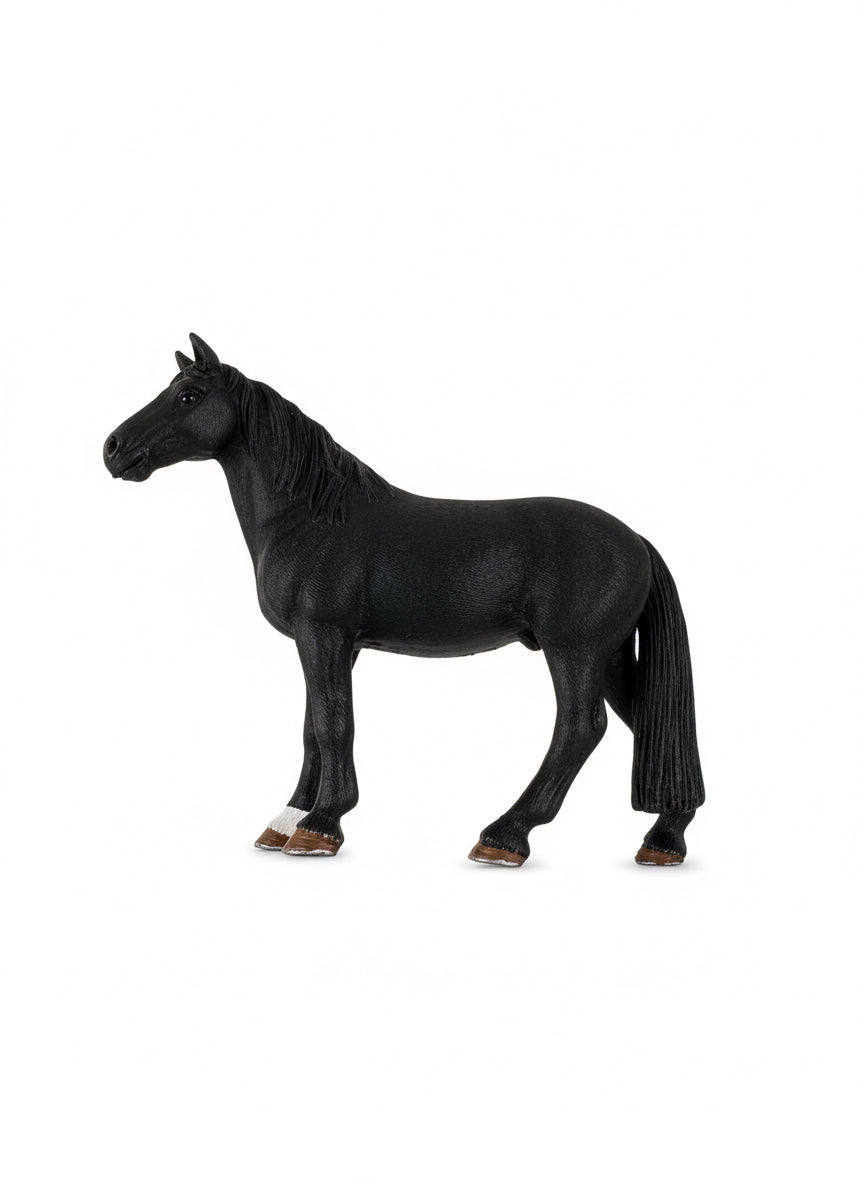 Black horse figurine with a price tag on a gray surface