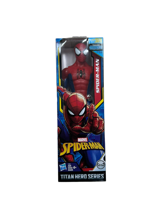 Spider-Man toy figure in packaging on a wooden floor