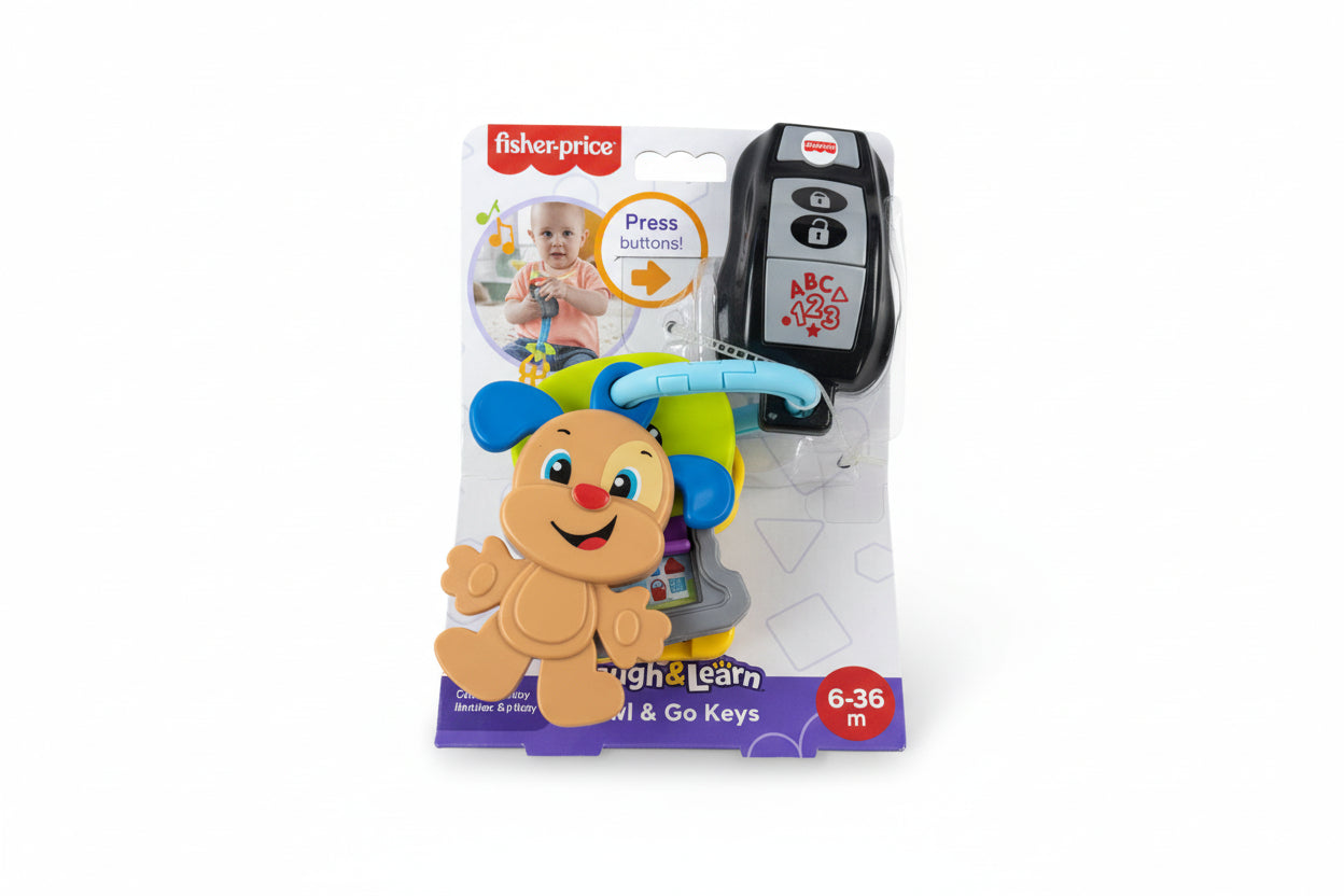 Fisher-Price Laugh & Learn toy on a gray surface