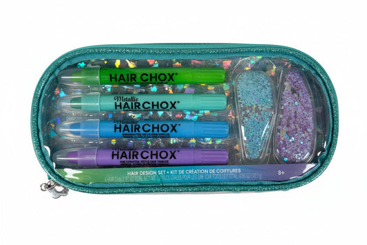 Set of Hair Chox hair design tools in a clear case on a wooden surface