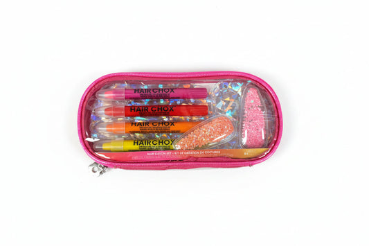 Hair chocking set in a pink case on a gray surface