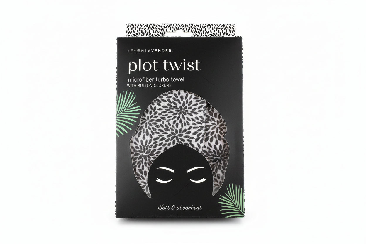 Packaging of a microfiber turbo towel with leopard print design on a textured surface