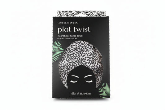 Packaging of a microfiber turbo towel with leopard print design on a textured surface