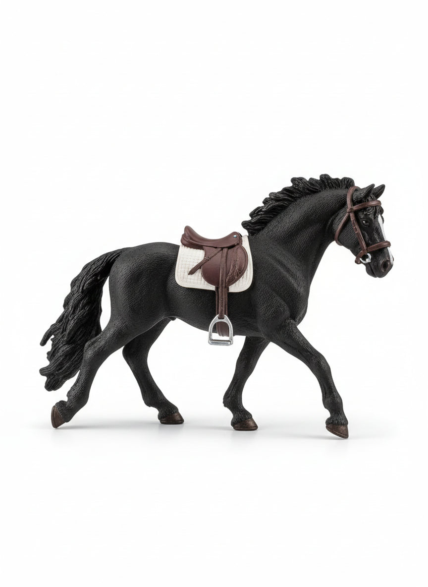 Toy horse with a saddle on a wooden floor